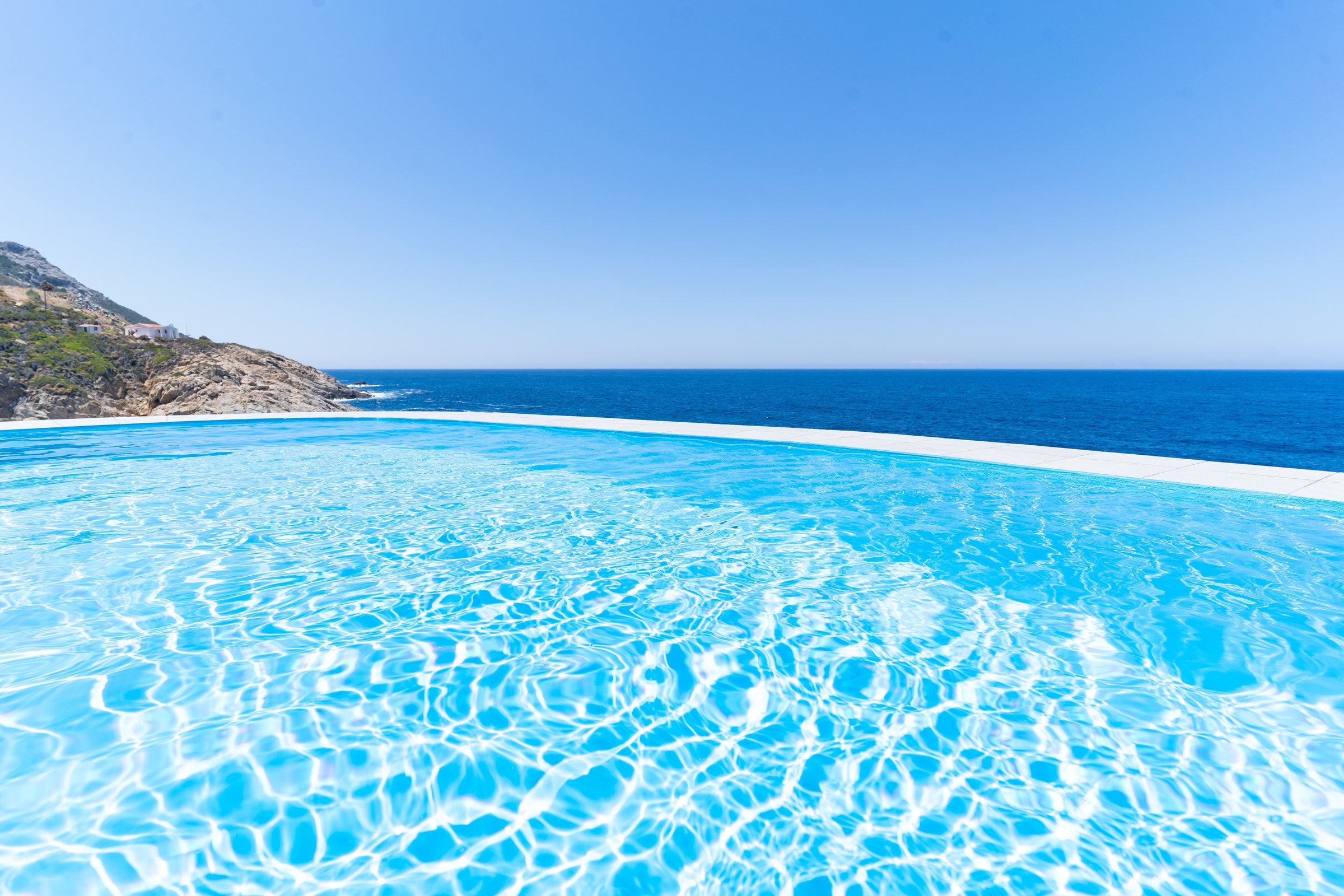 Infinity pool with sea horizon at the edge of the Aegean