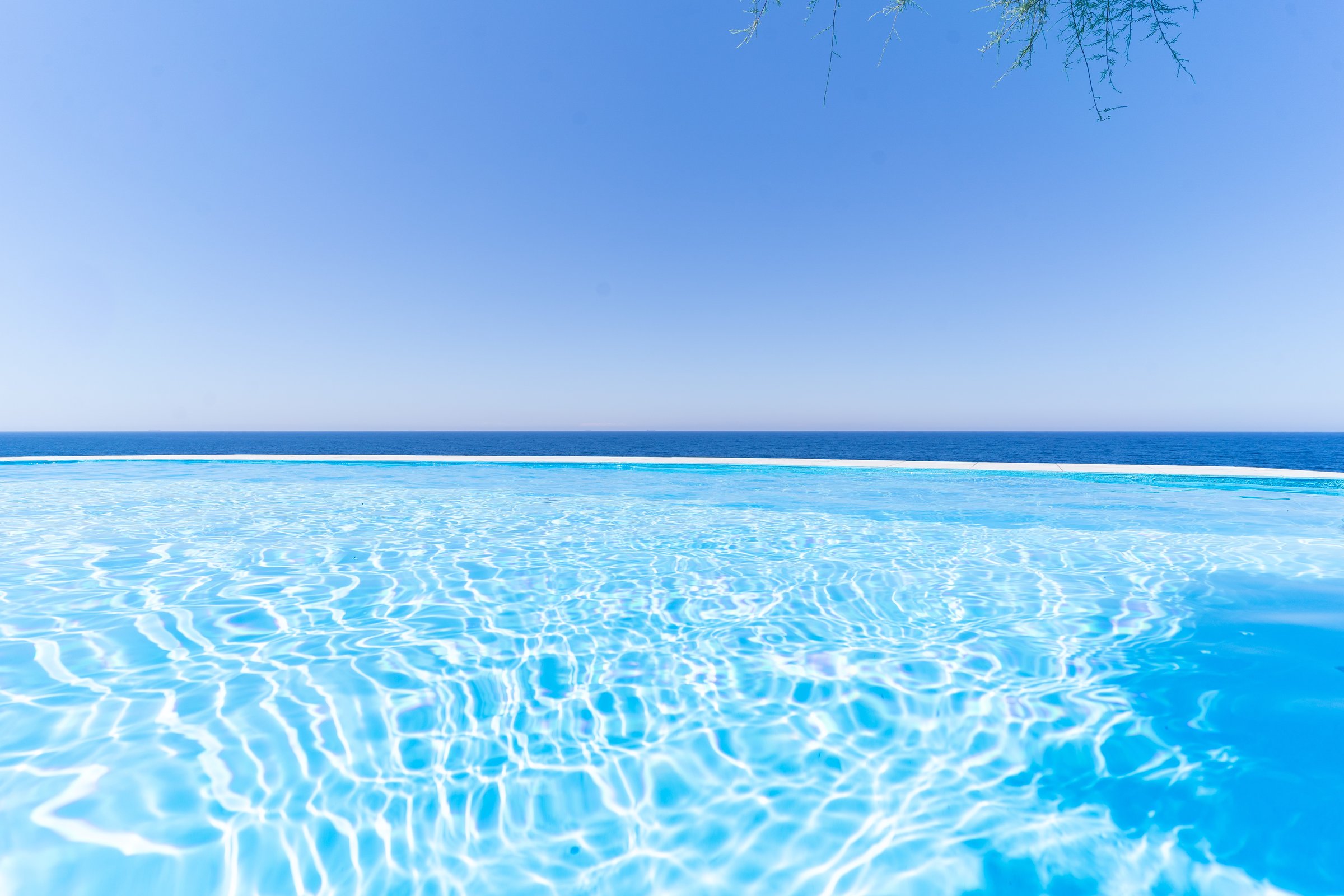Infinity salt-water pool at sunset